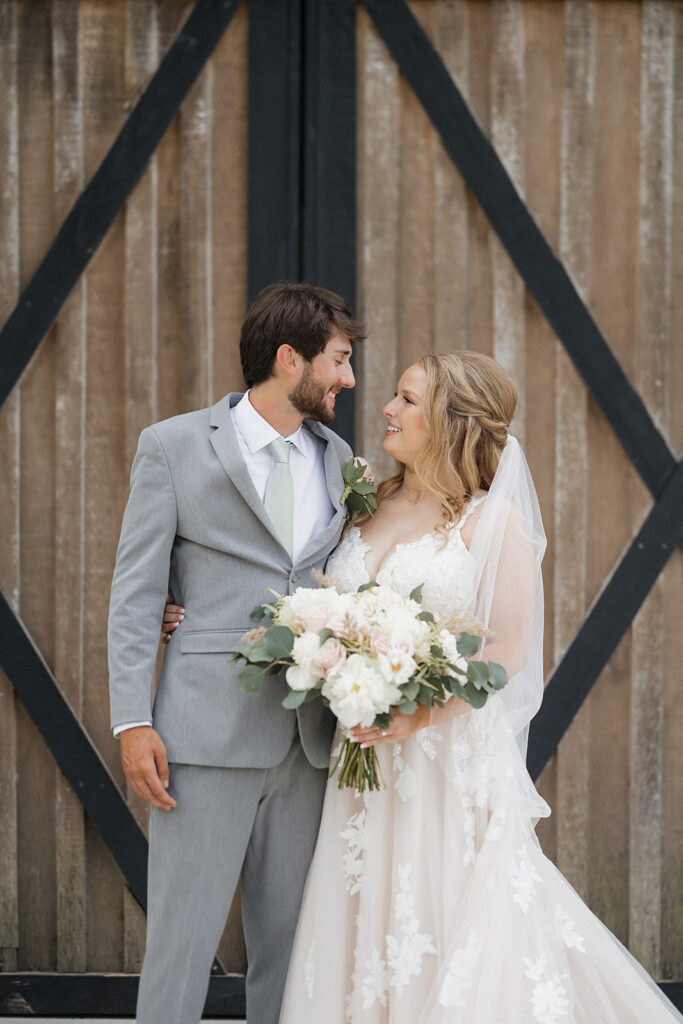 bride and groom looking at each other 