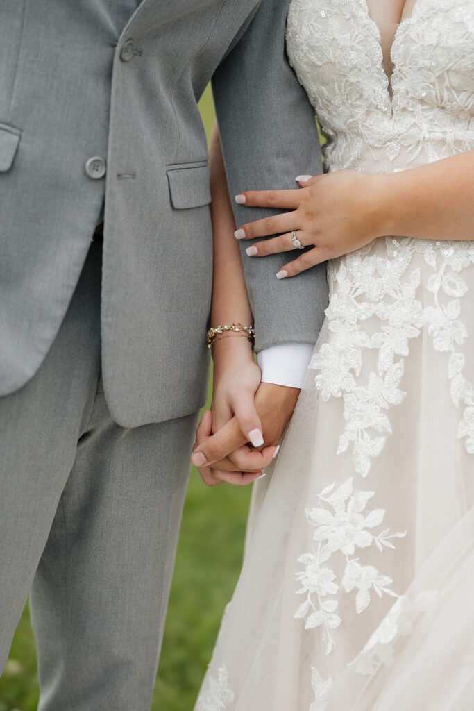 bride and groom holding hands during their photoshoot