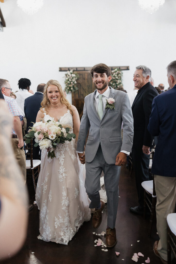 happy couple heading to their wedding reception