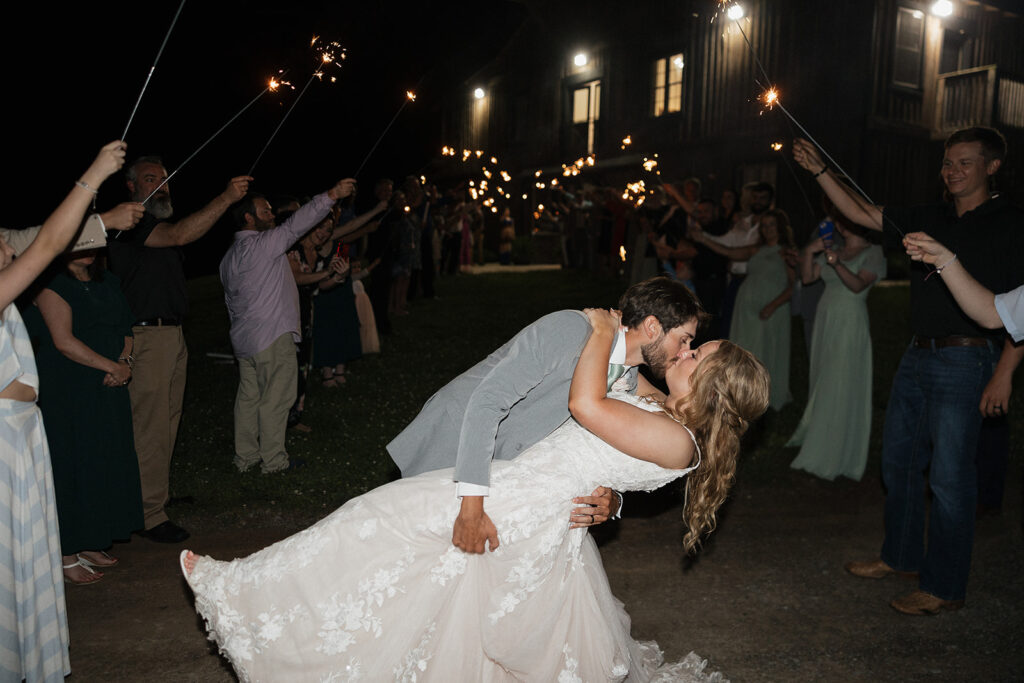 bride and groom kissing after their wedding party