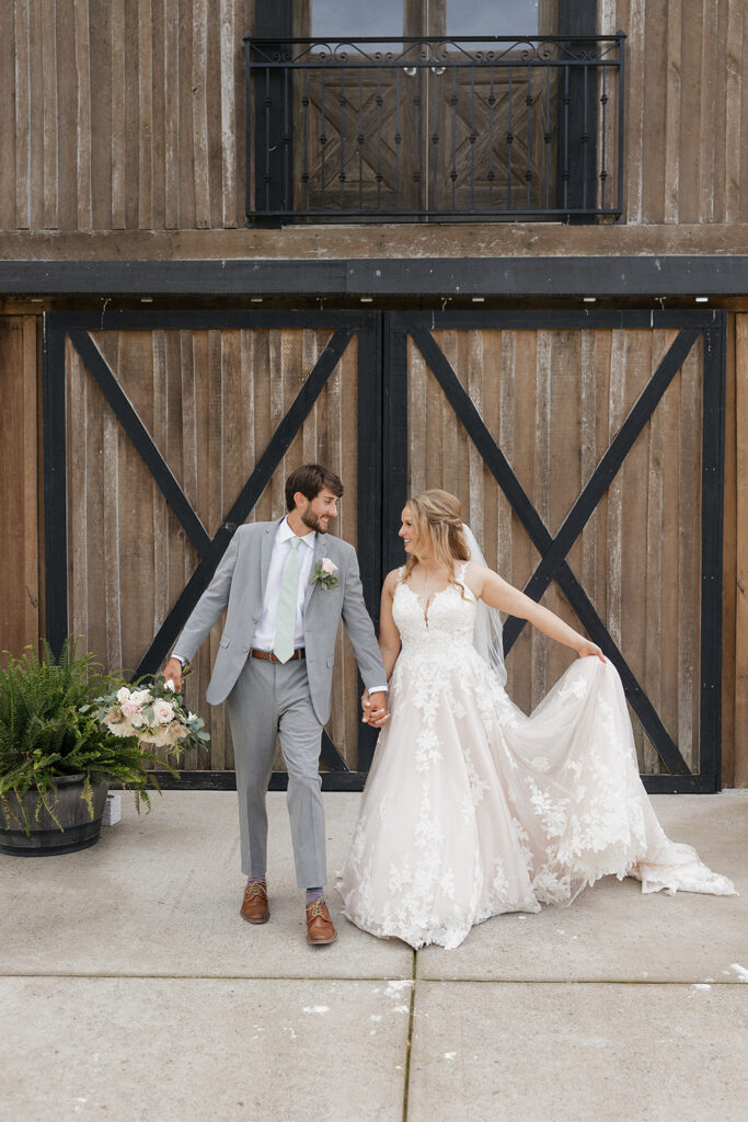 bride and groom holding hands