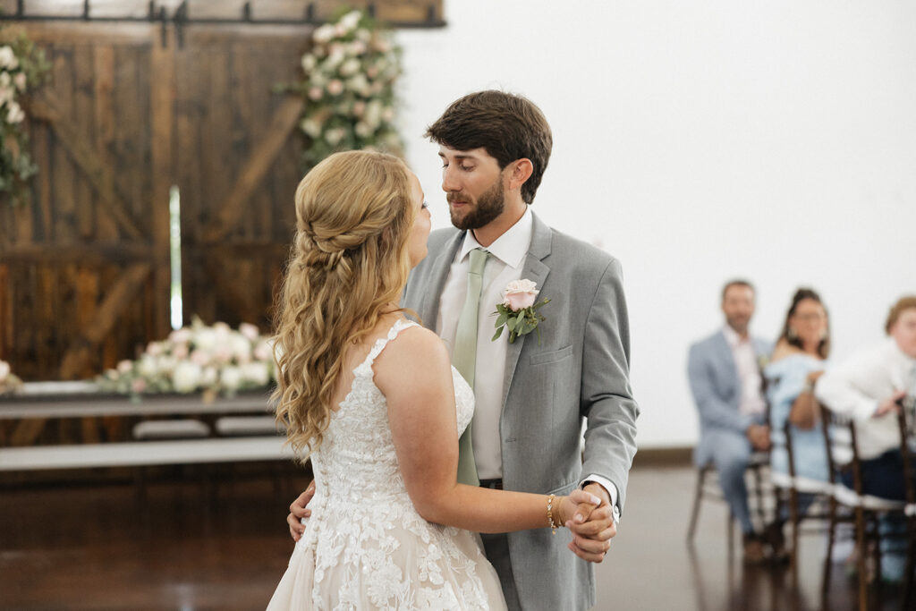 bride and groom first dance at their wedding reception