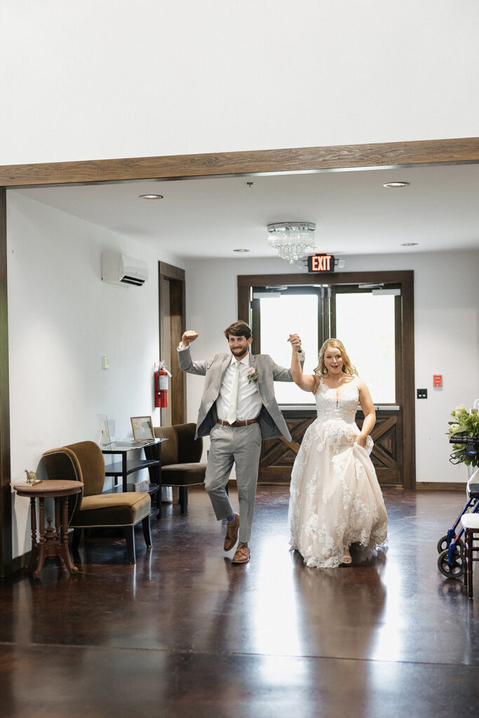 bride and groom entering the wedding reception