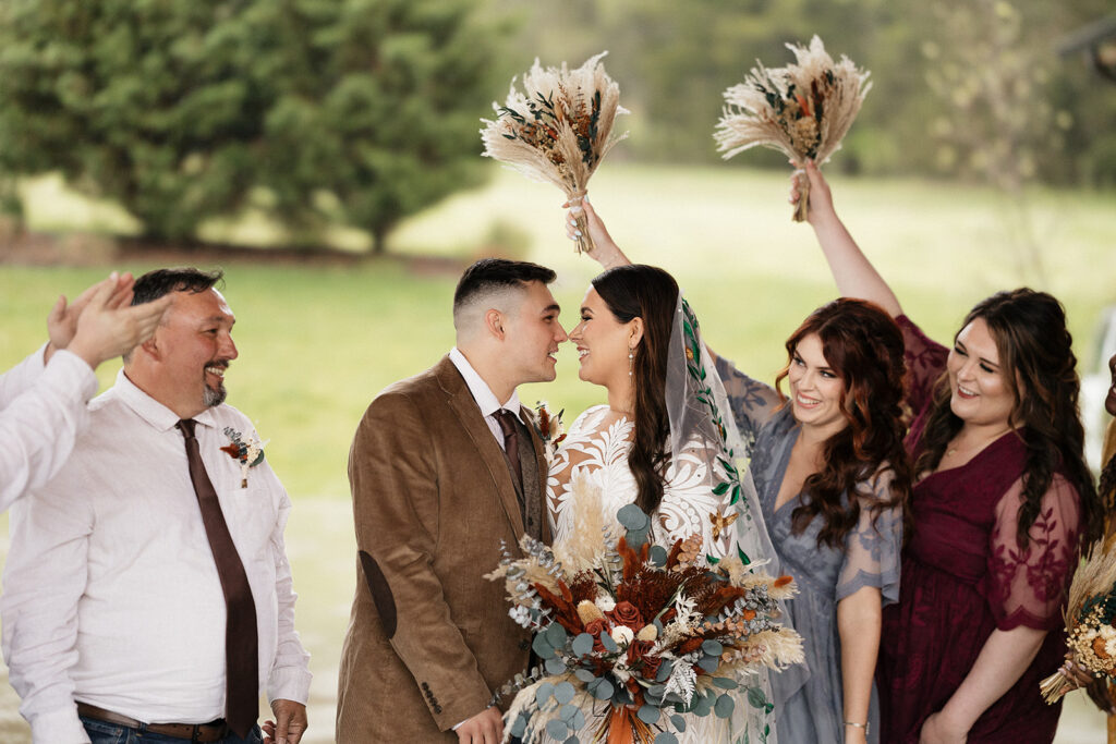 bride and groom looking at each other 