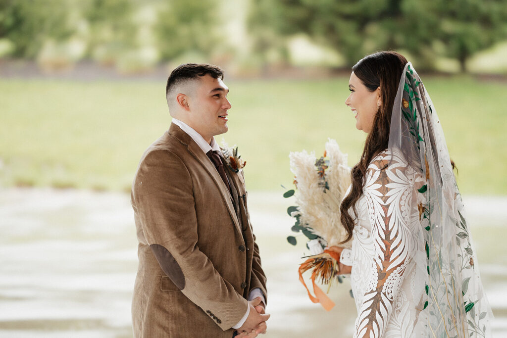 bride and groom reading their wedding vows 