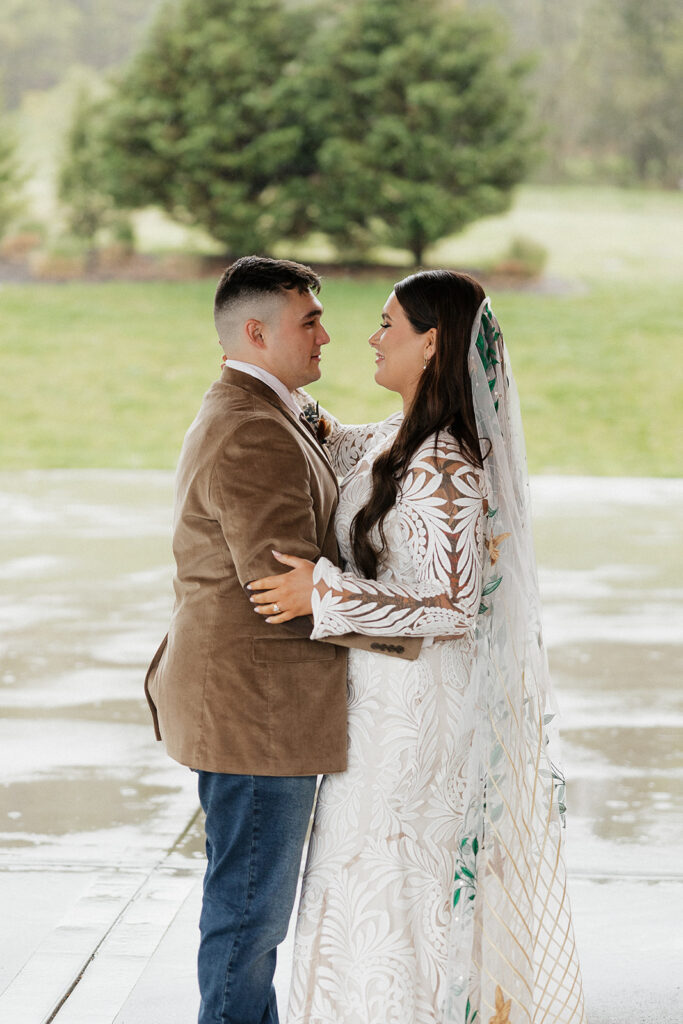 bride and groom looking at each other 