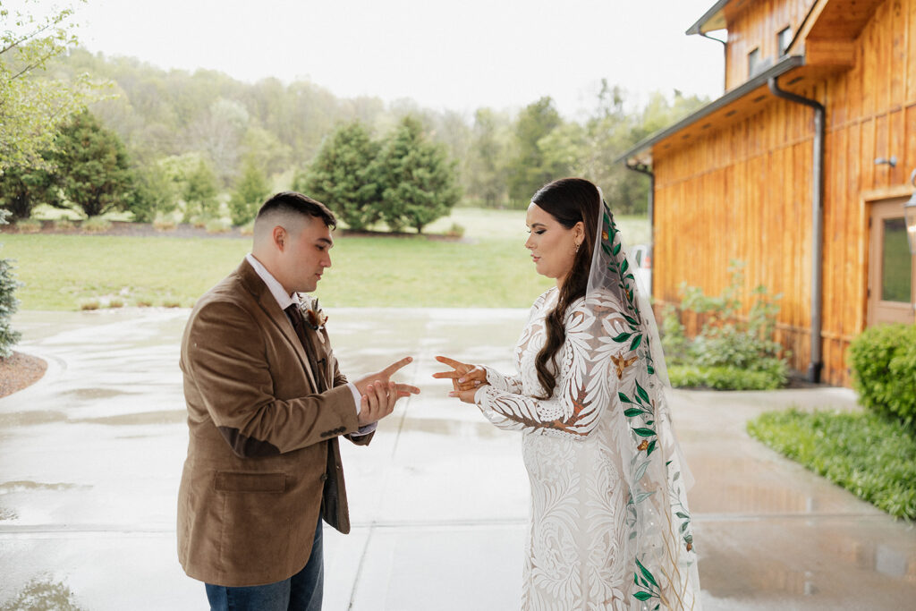 bride and groom paying rock, paper, scissors