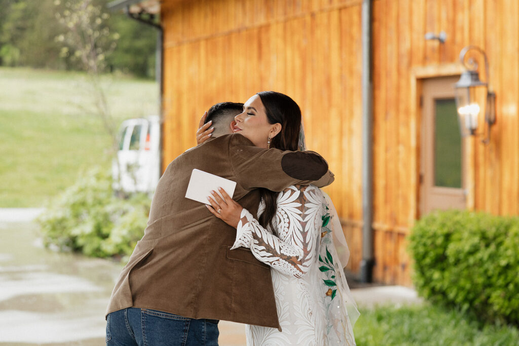 bride and groom hugging 