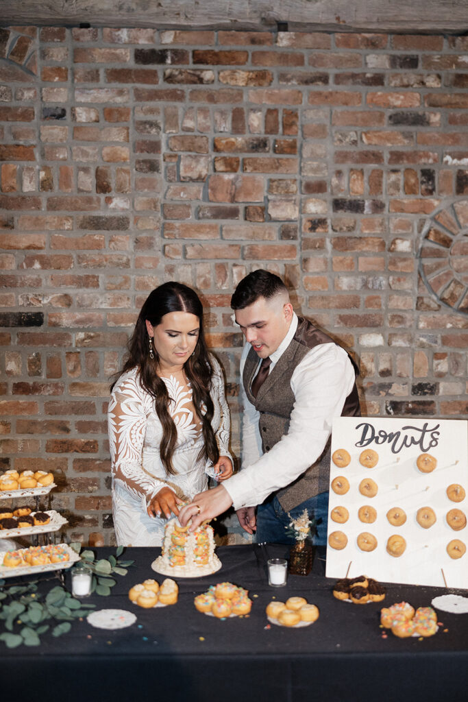 bride and groom cutting their wedding cake