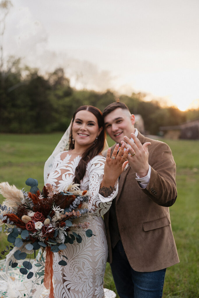 couple showing their wedding rings 