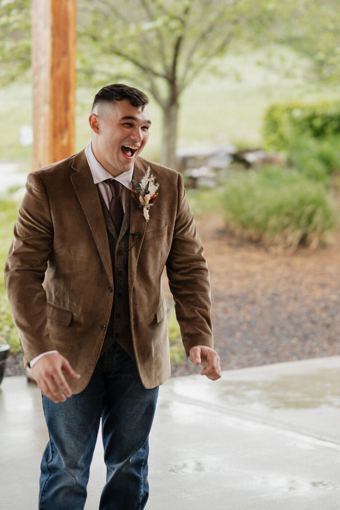 groom emotional seeing the bride in her wedding dress