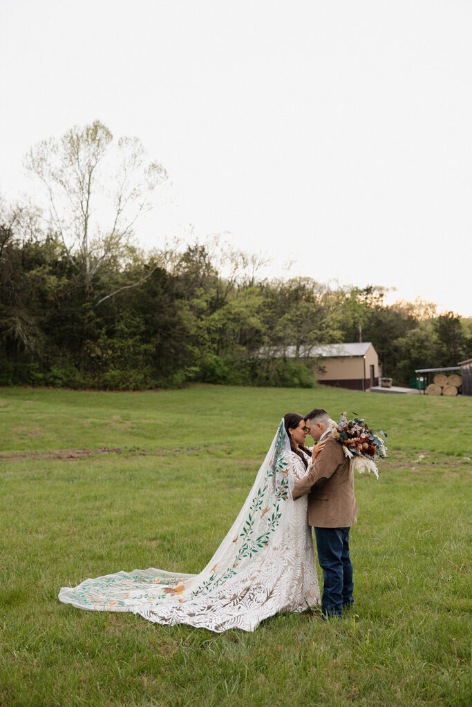 bride and groom hugging 