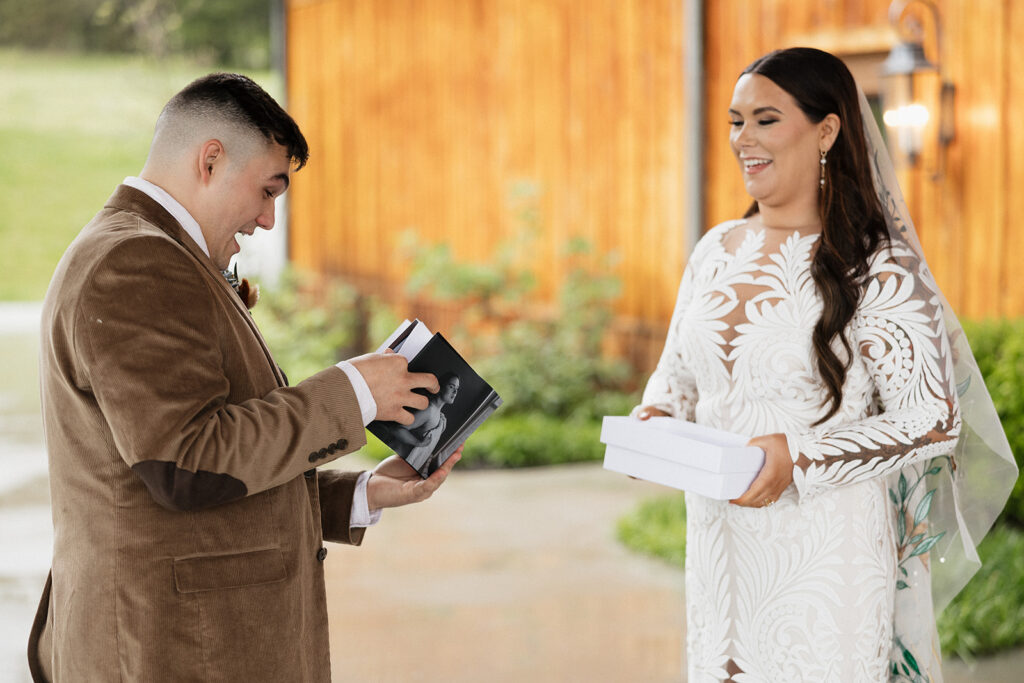 groom opening his wedding gift 