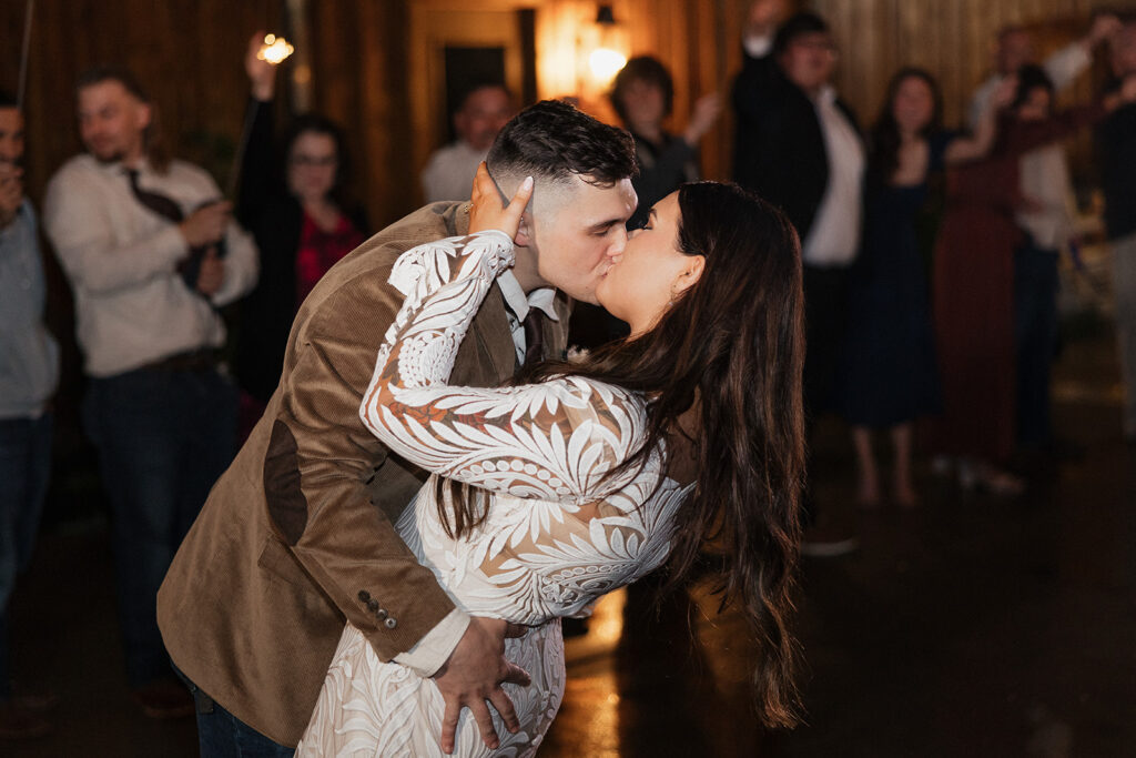 bride and groom kissing at their wedding party