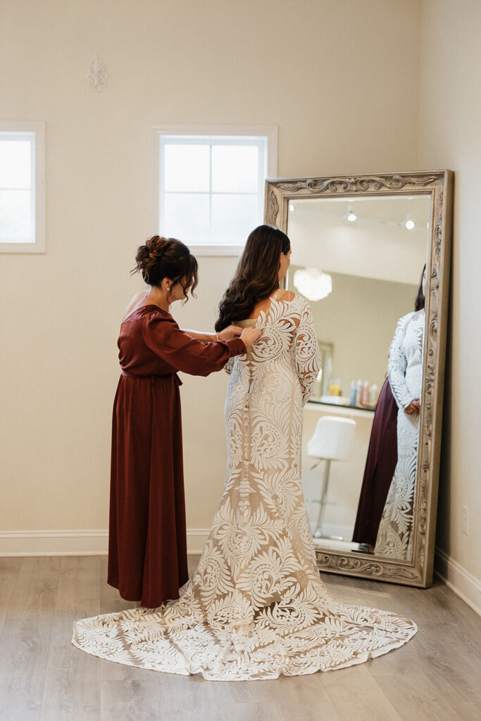 bride getting ready for her boho wedding