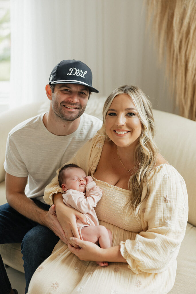 cute parents with their baby at their newborn session