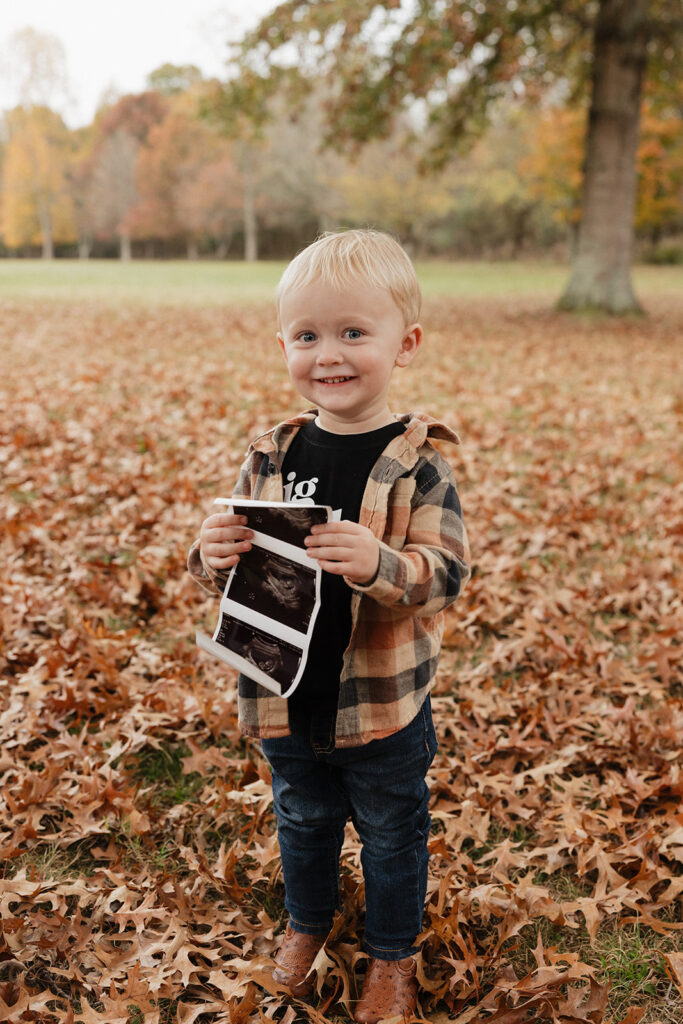 soon to be big brother at their outdoor family session