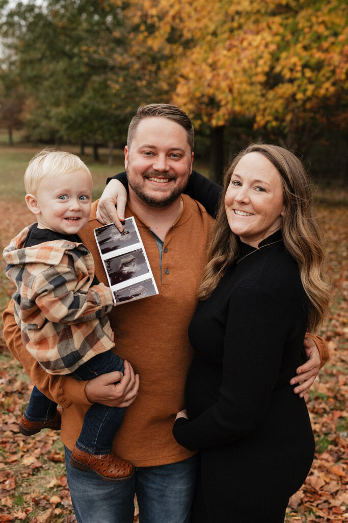 happy family at their fall pregnancy announcement 