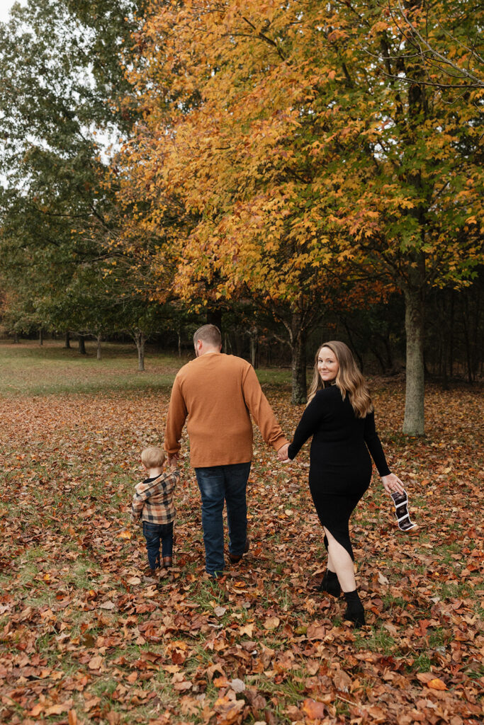 family walking around the park during their photoshoot