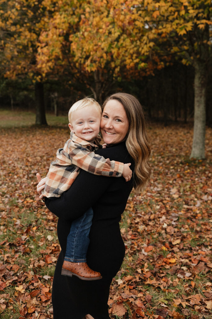 mom holding her little boy during their photoshoot