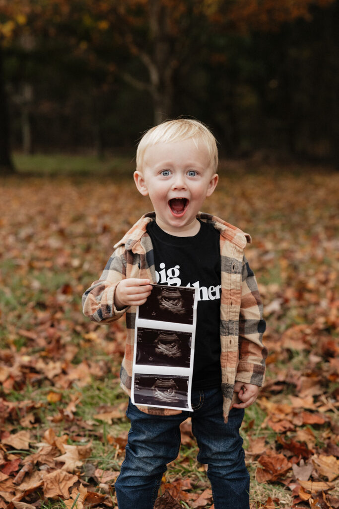 little boy excited for his little brother