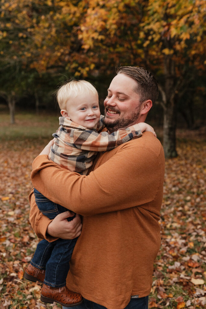 dad holding his little boy