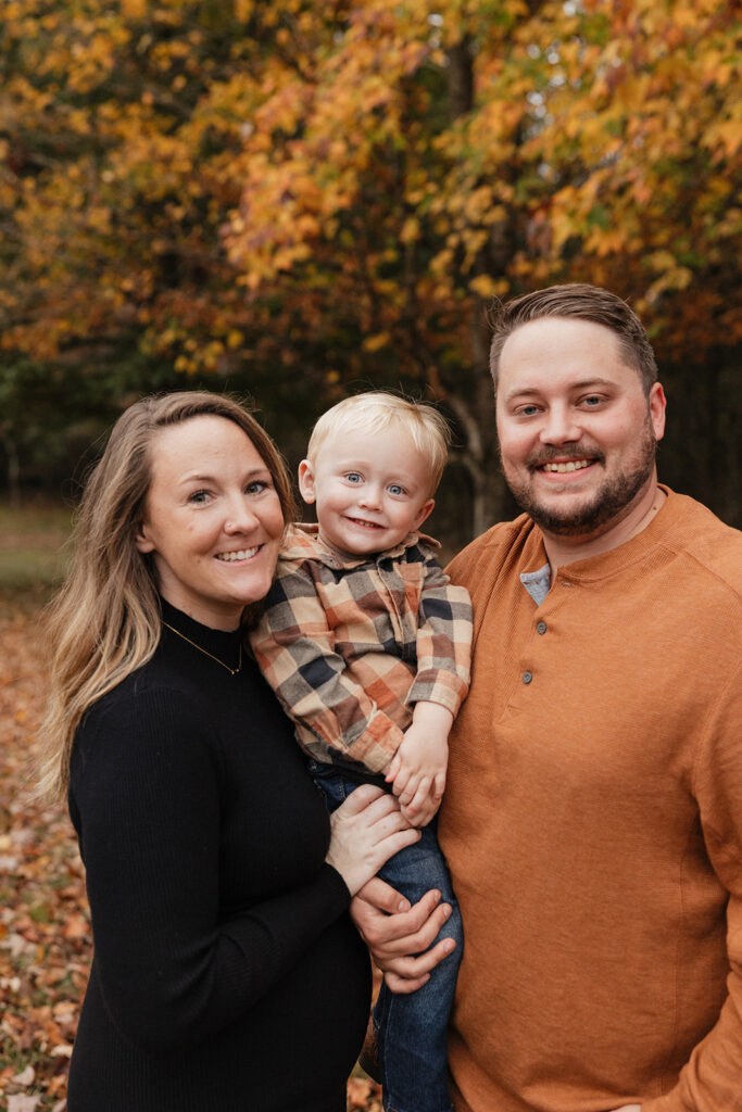 family smiling at the camera