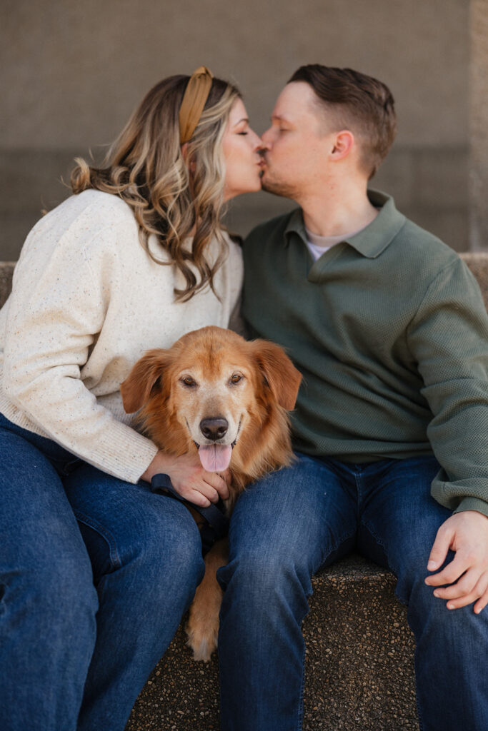 cute picture of the newly engaged couple kissing