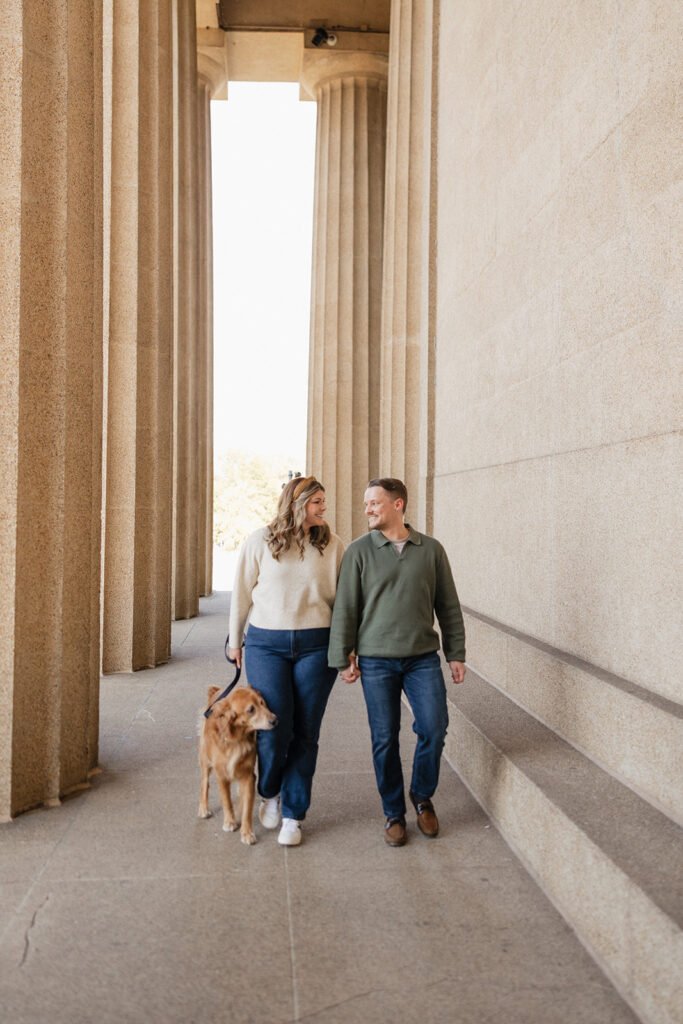 cute couple walking around nashville with their dog