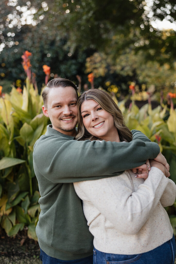 cute couple hugging looking at the camera