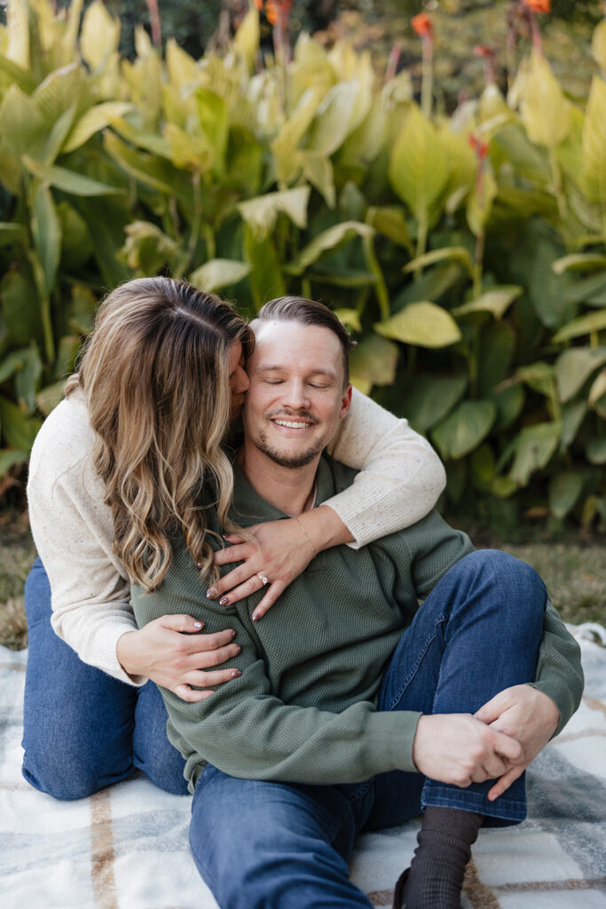 fiance kissing her fiance on the cheek