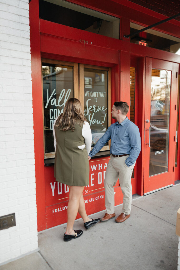 cute couple buying ice cream during their photoshoot