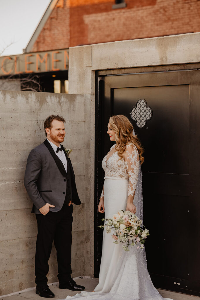 newlyweds laughing with each other during their photoshoot