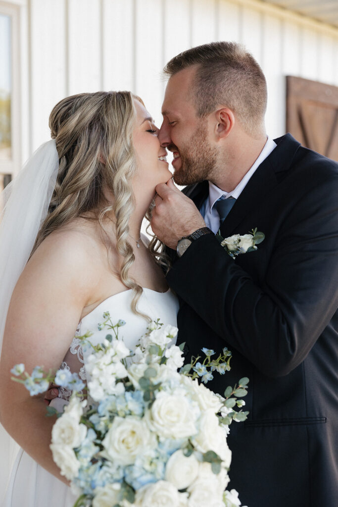 cute couple smiling at each other during their photoshoot