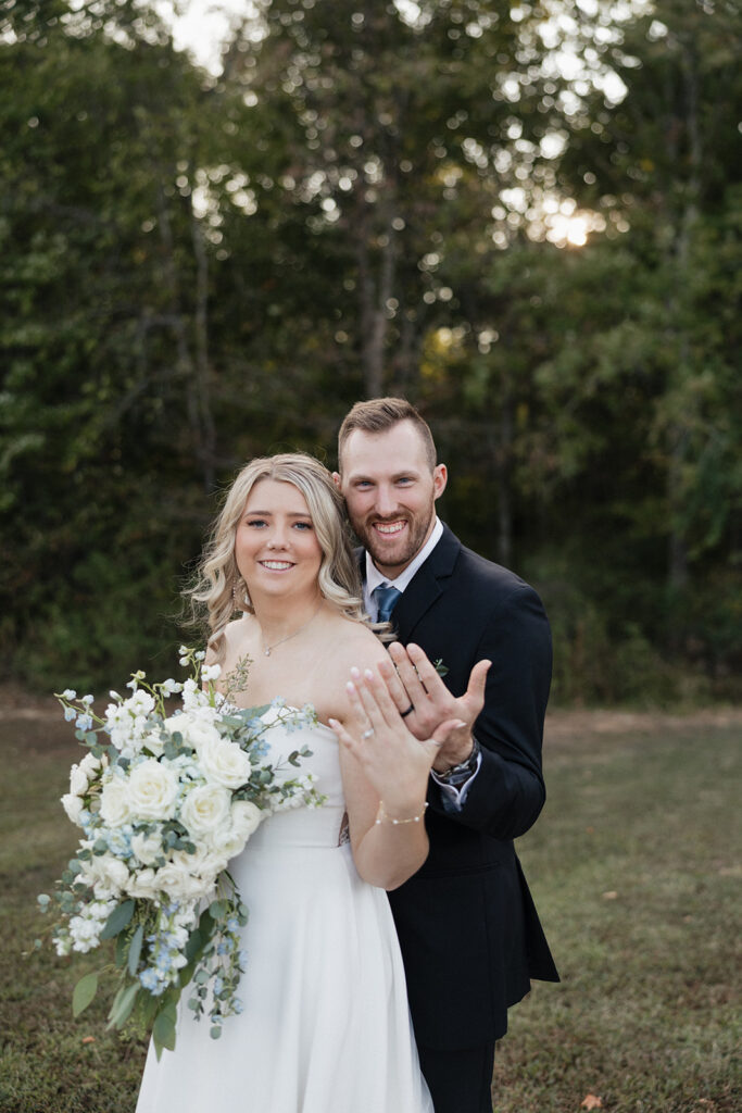 cute couple showing their wedding rings 