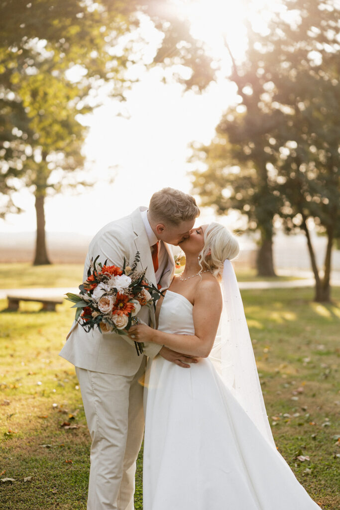 newlyweds kissing during their bridal photoshoot