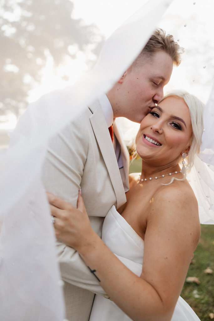 couple looking at the camera during their bridal portraits