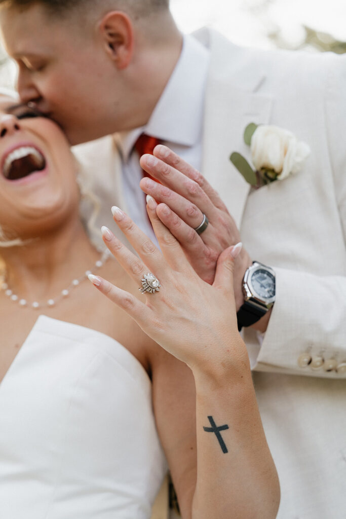 newlyweds showing their wedding rings