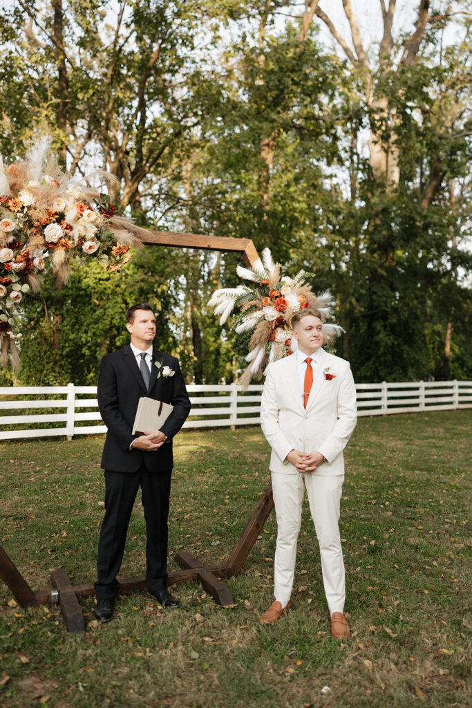 groom waiting for the bride at the aisle 