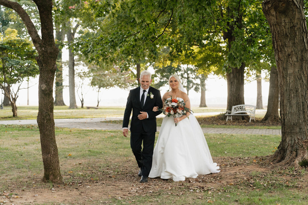 stunning portrait of the bride walking down the aisle 