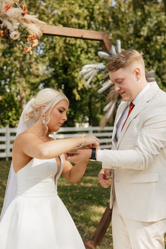 happy bride and groom at their colorful boho wedding first look