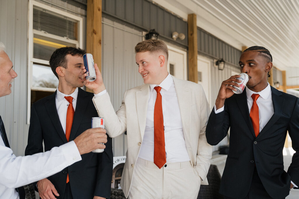 fun picture of the groom and his friends before heading to the colorful boho wedding ceremony