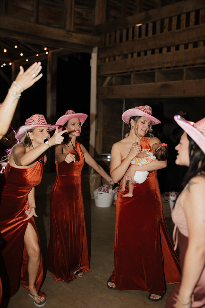 bridesmaids dancing at the party