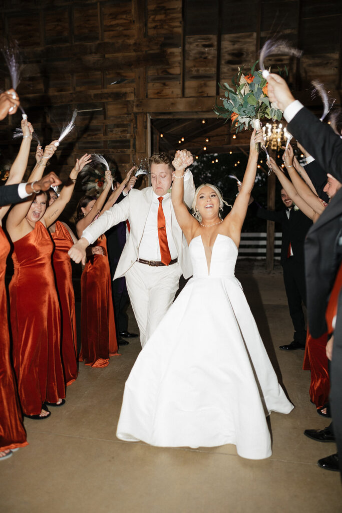 newlyweds entering the reception party