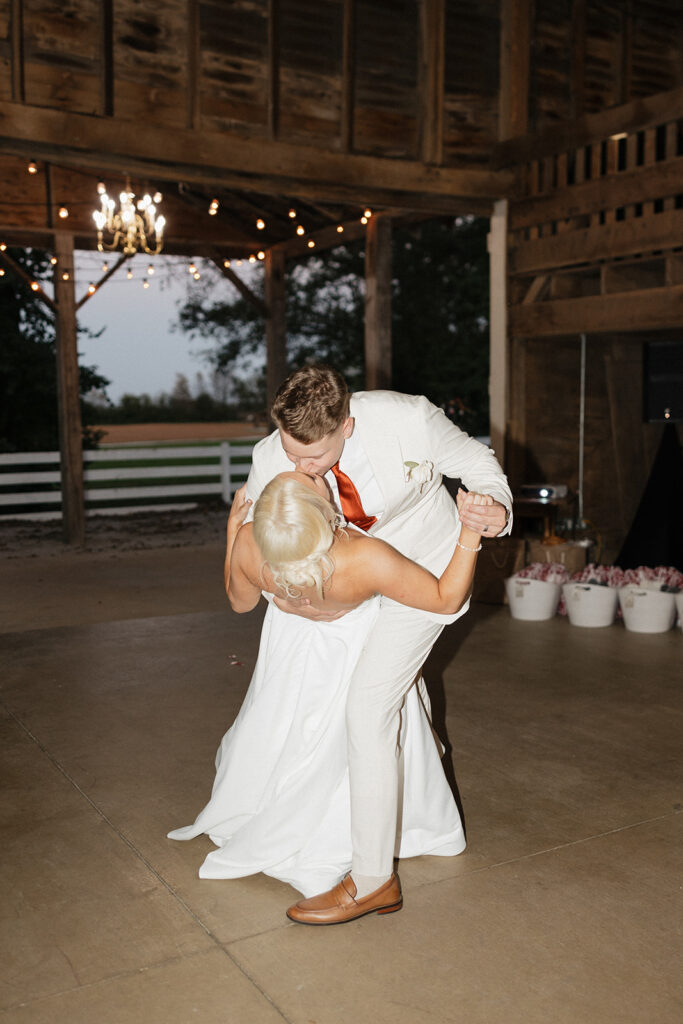 cute couple kissing after their first dance