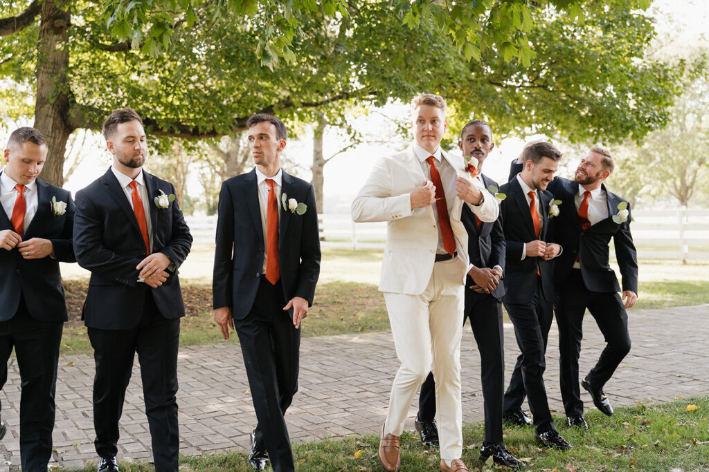 groom and his friends heading to the reception party