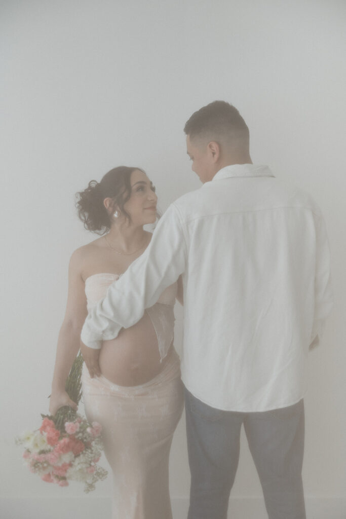 married couple looking at each other during their session