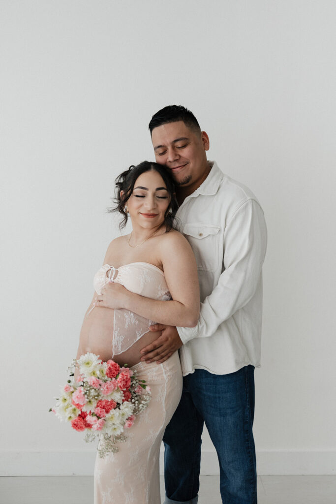 couple hugging during their maternity session