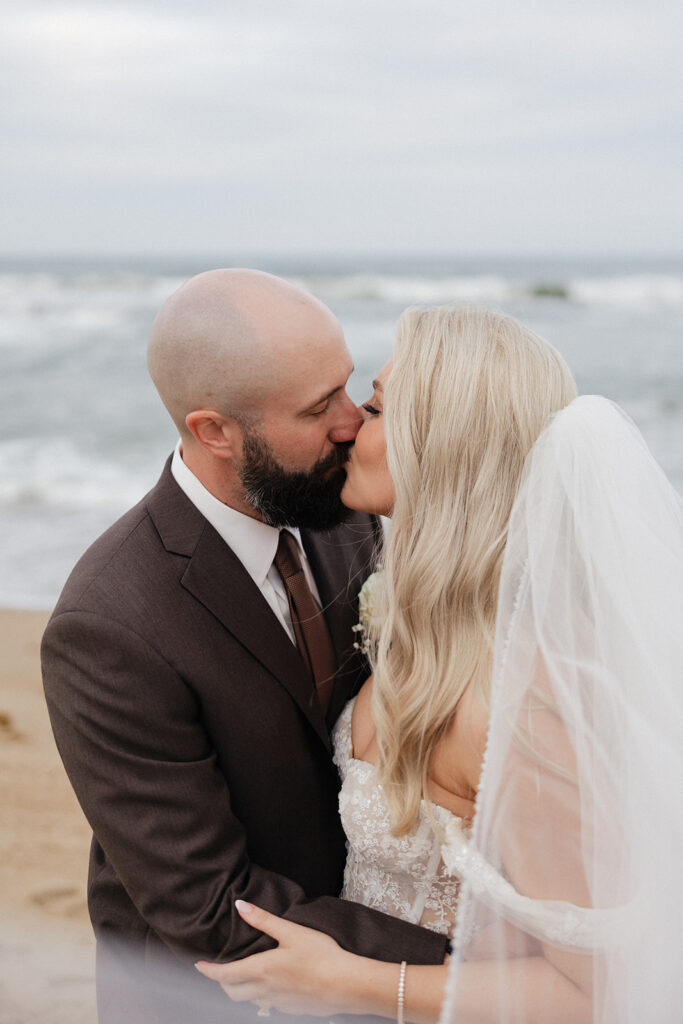 portrait of the bride and groom kissing