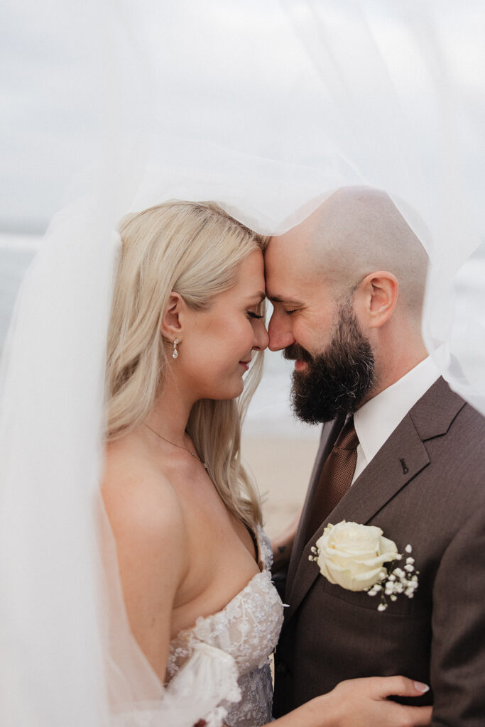 portrait of the bride and groom looking at each other